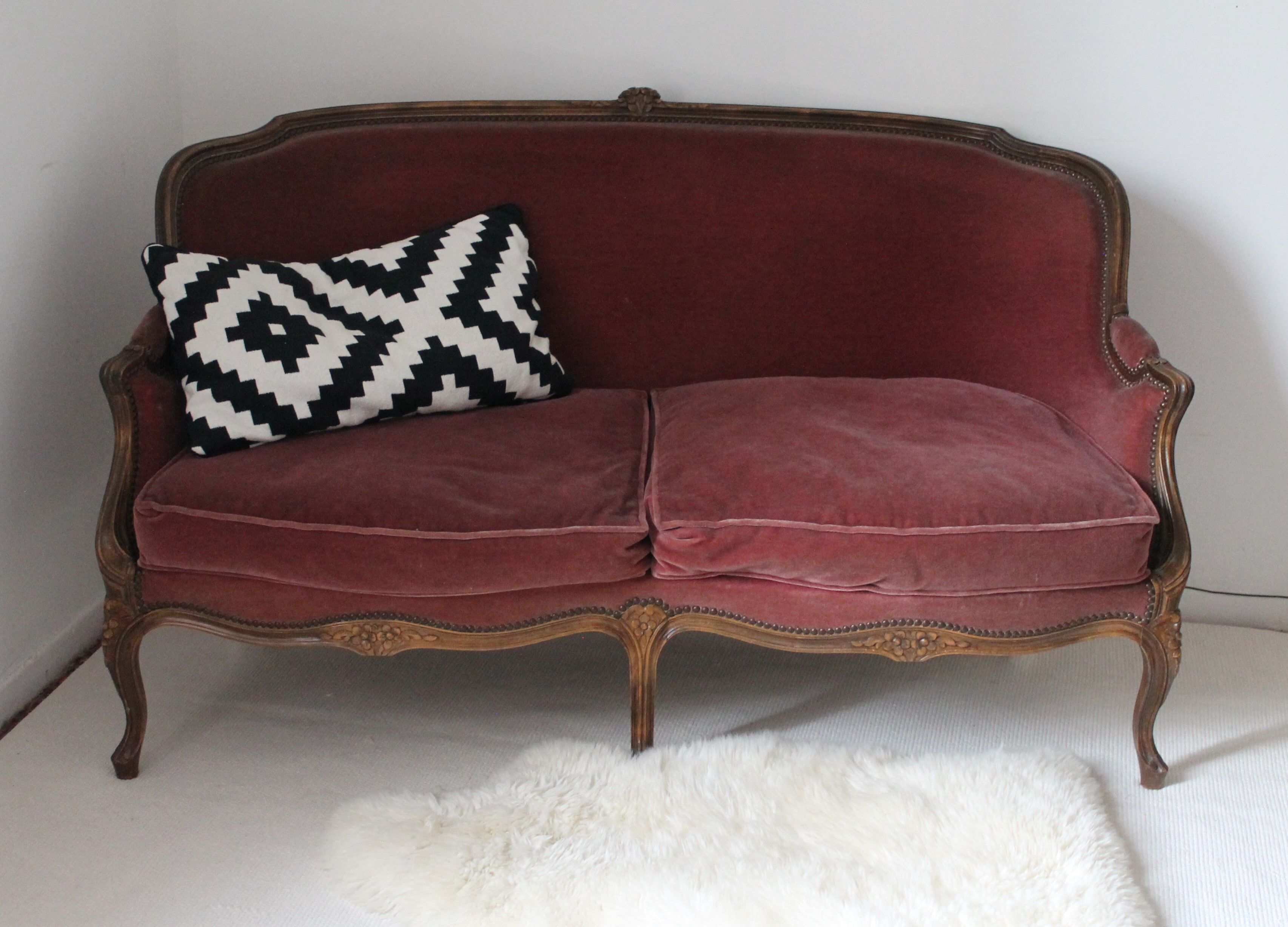 Faded pink velvet sofa