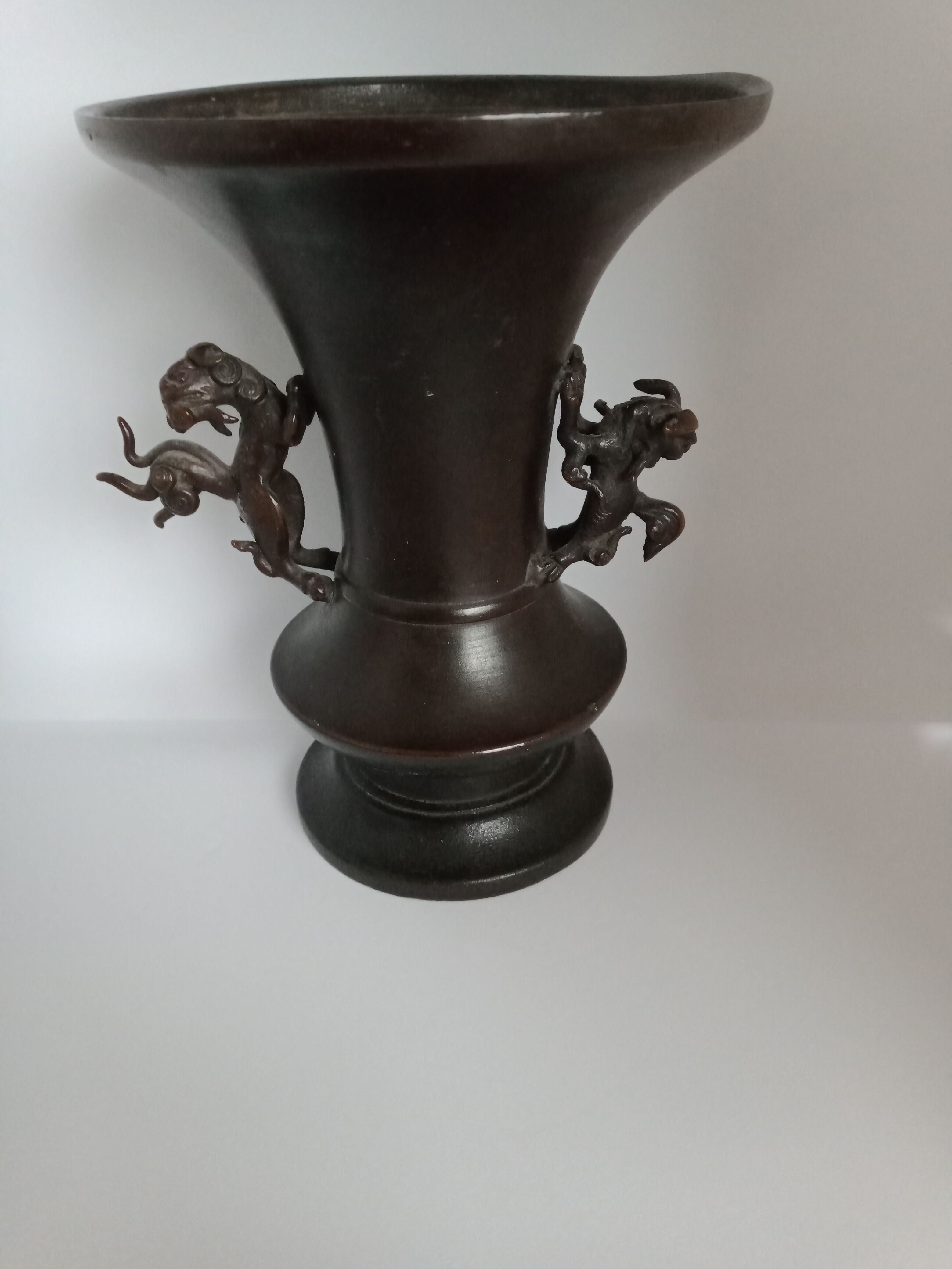 Chinese bronze vase with brown patina decorated with dragon and pho dog