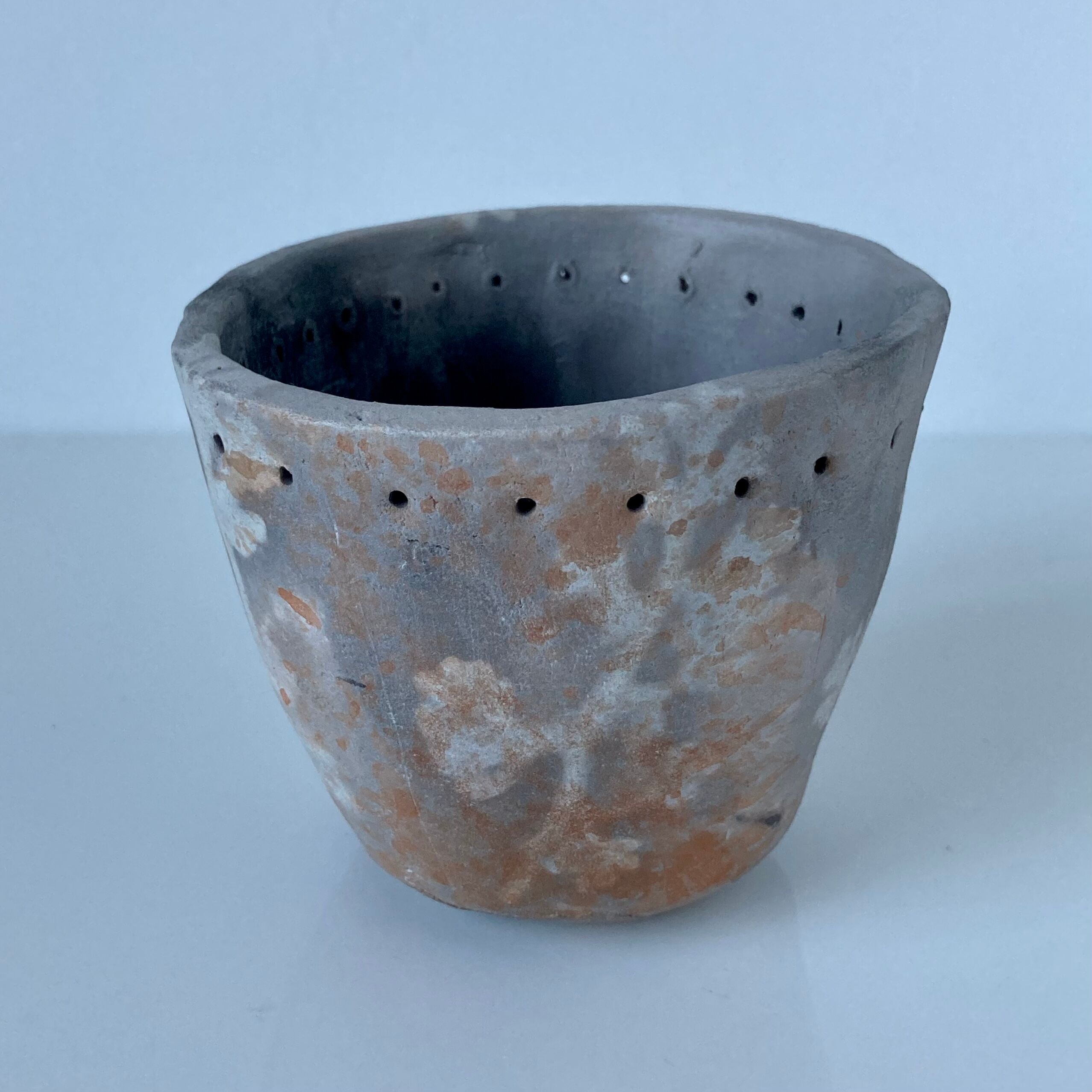 Signed ceramic pot with plant decoration
