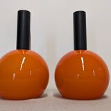 Pair of orange opaline ball pendants by Parscot, France circa 1970.