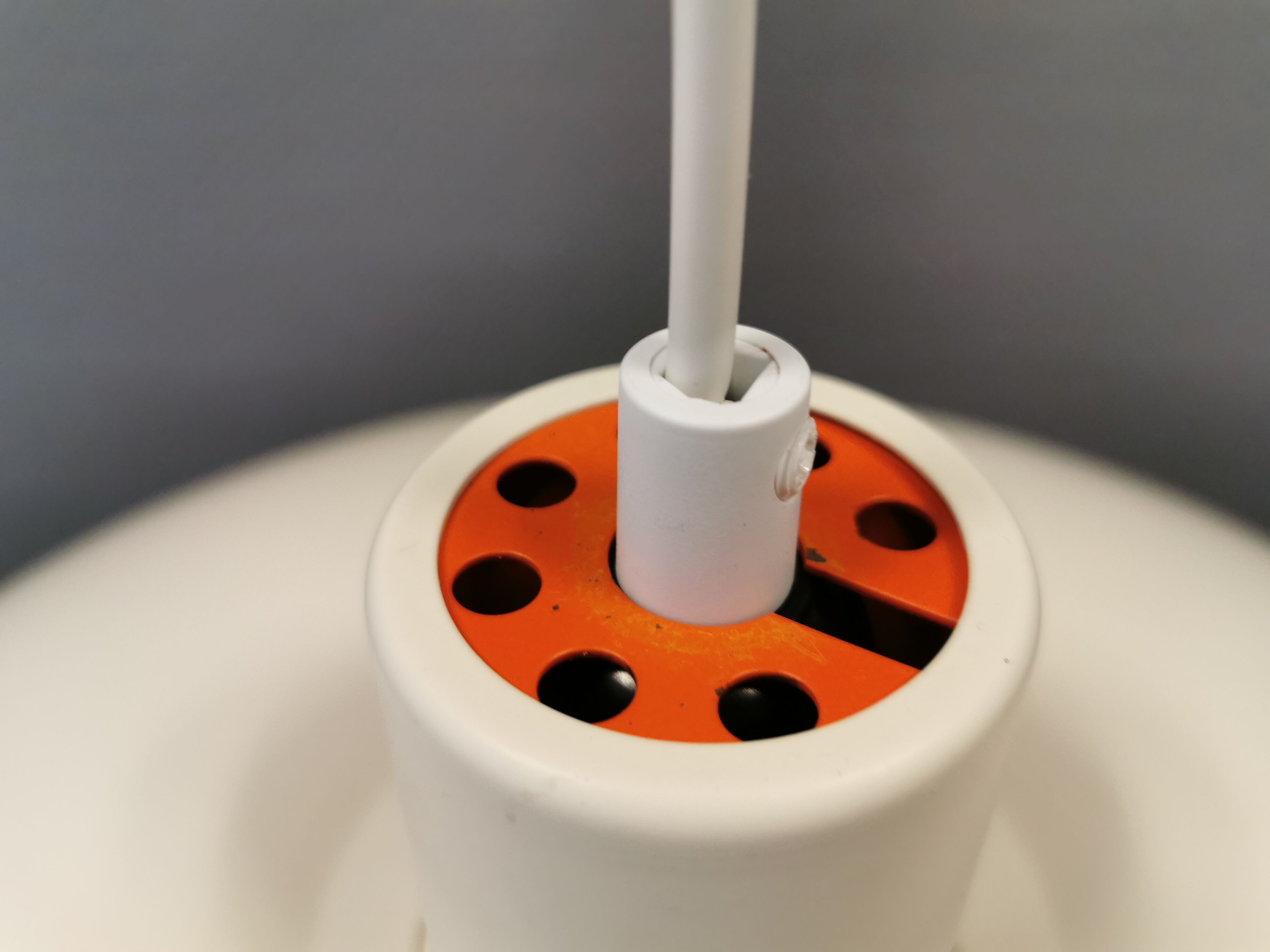 Older ph 4/3 hanging lamp, in white, with original orange suspension disk.