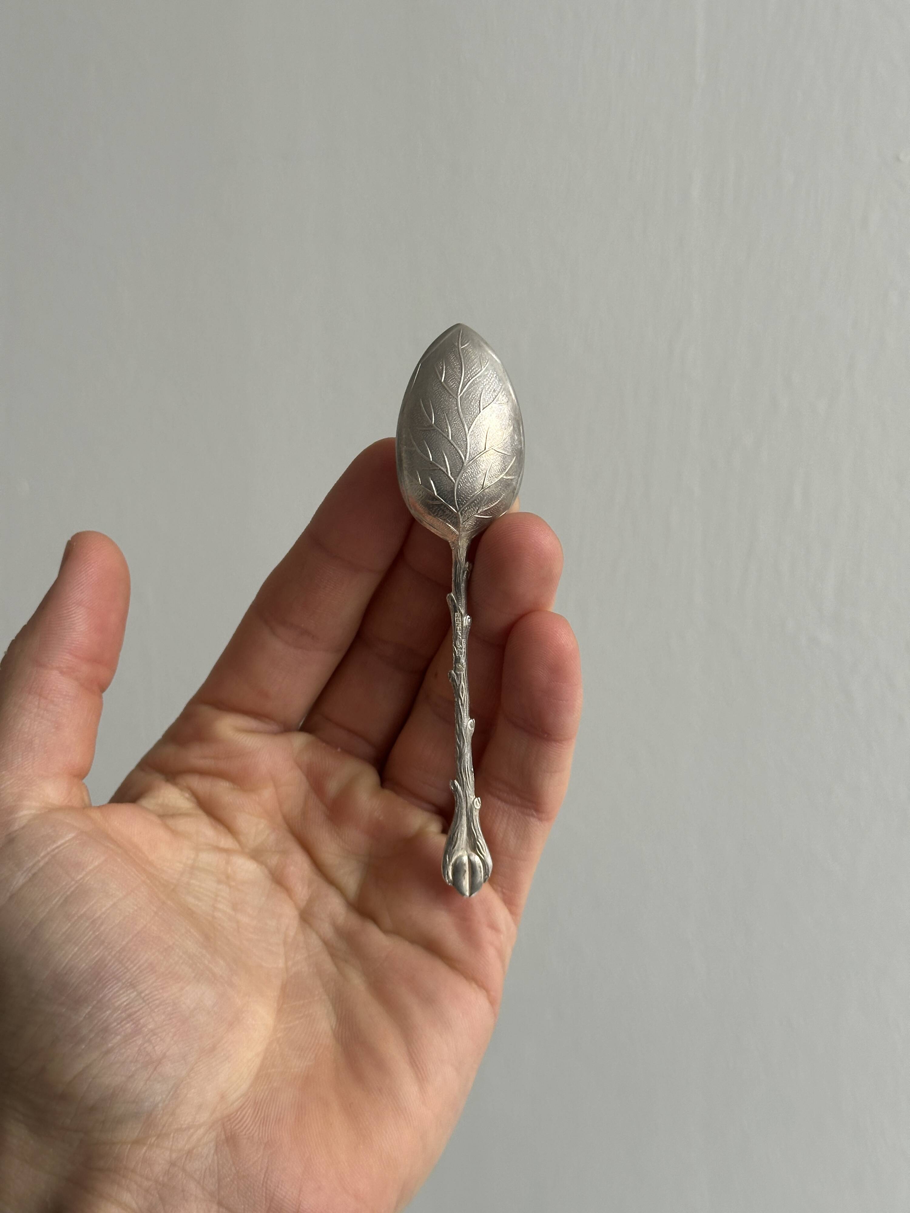 Set of 10 small silver metal spoons