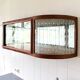 Art Deco-style wall-mounted display cabinet with floral engraving
