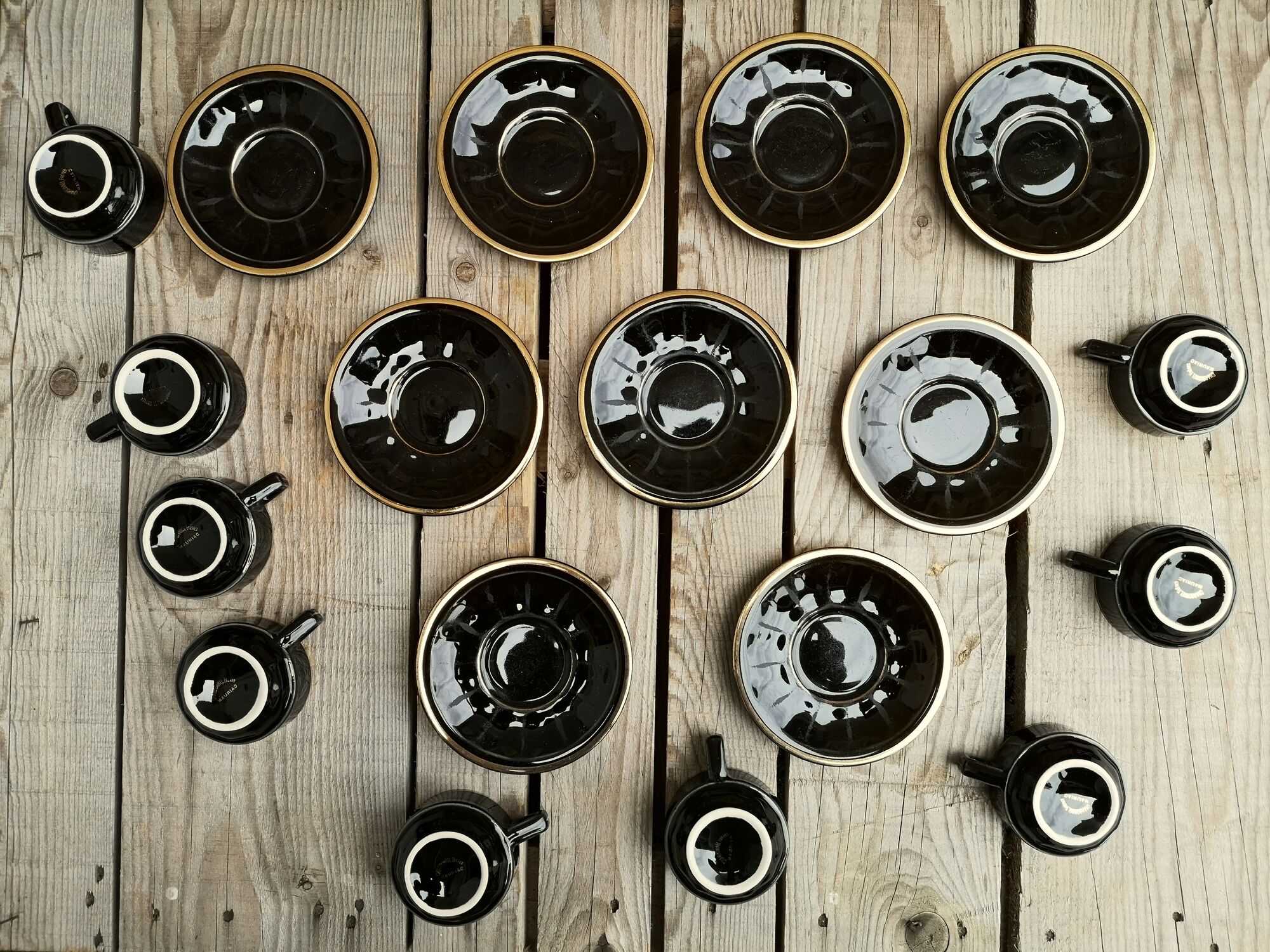 Set of 9 cups and sub-cups in black ceramic and colored gold border