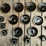 Set of 9 cups and sub-cups in black ceramic and colored gold border