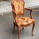 Louis XV armchair in carved solid wood and red and yellow fabric