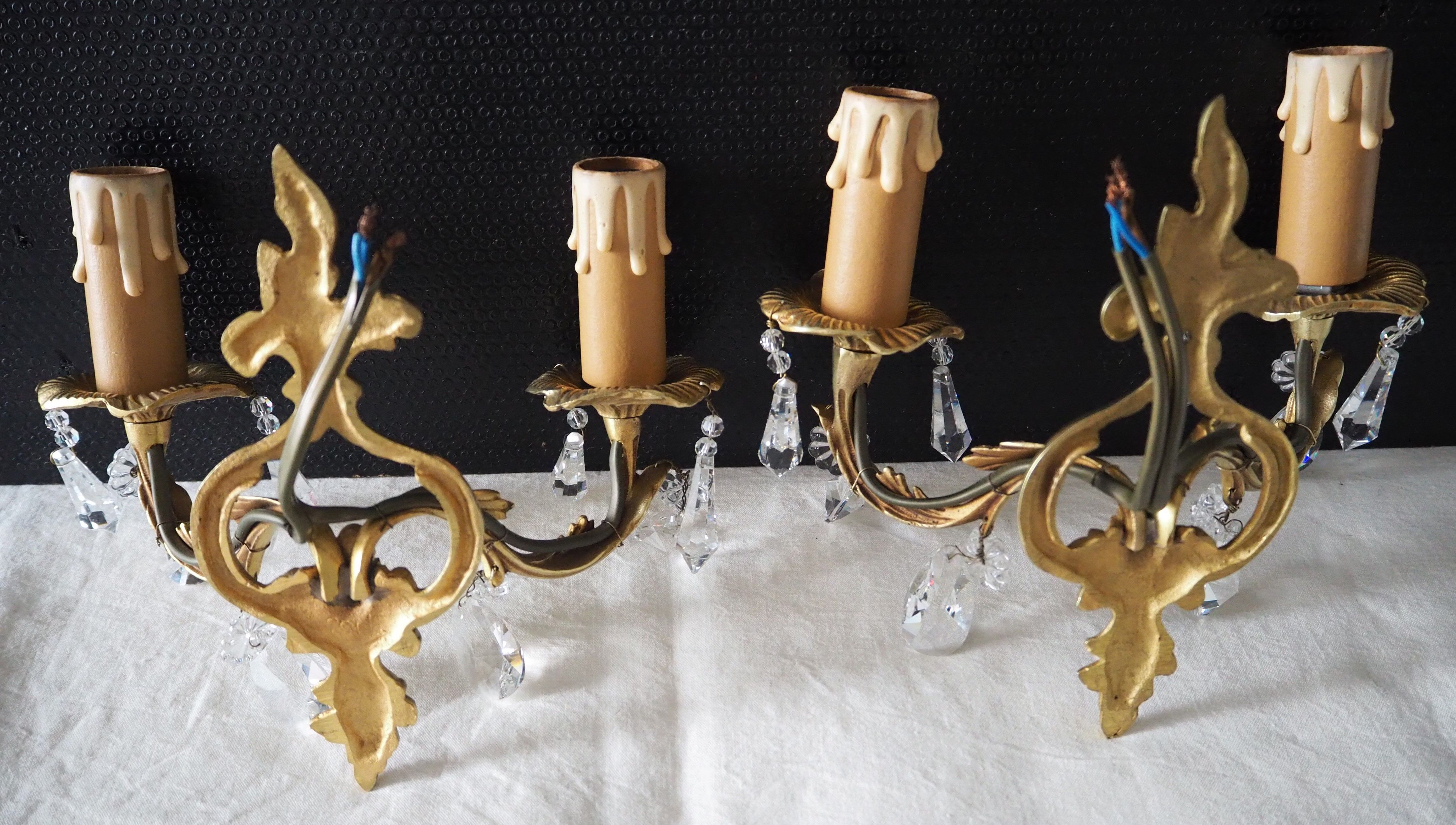 Pair of gilded bronze sconces and crystal pendants
