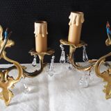 Pair of gilded bronze sconces and crystal pendants