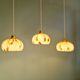 Trio of Art Deco pendant lights in marbled opaline glass, 1920s-30s