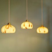 Trio of Art Deco pendant lights in marbled opaline glass, 1920s-30s