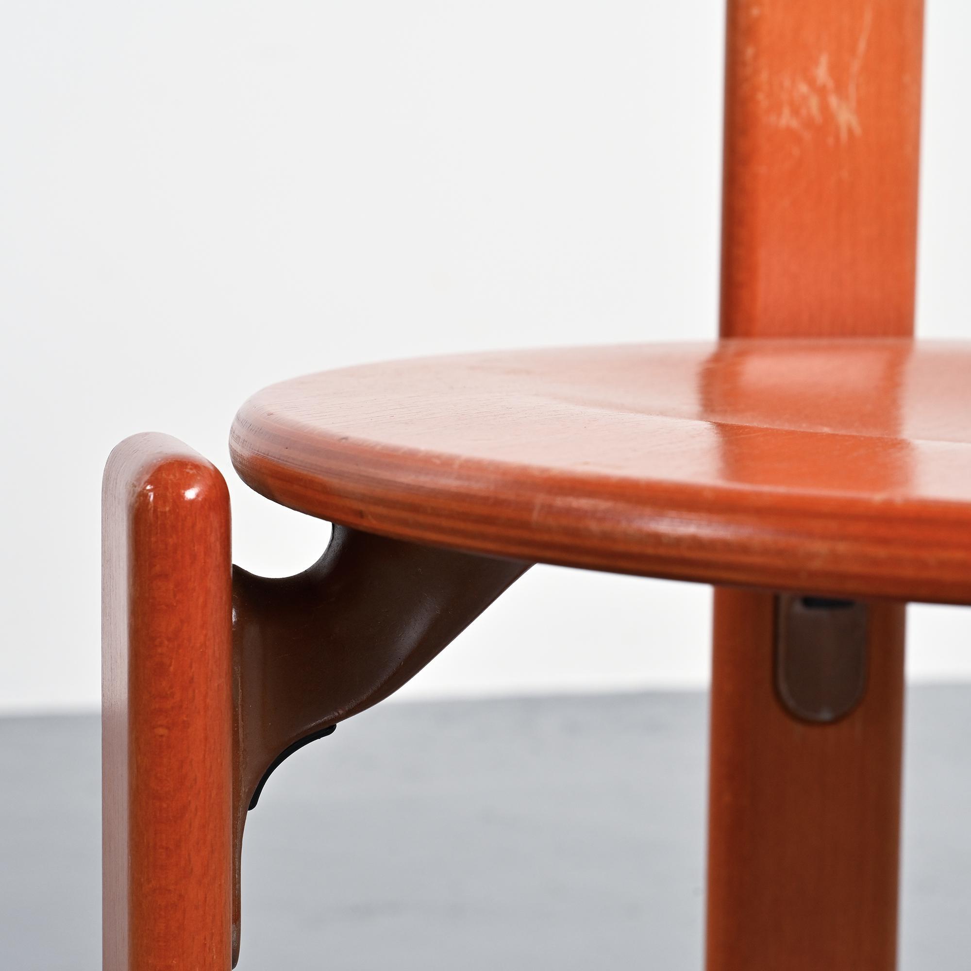 Rey chairs in stained red beech by Bruno Rey