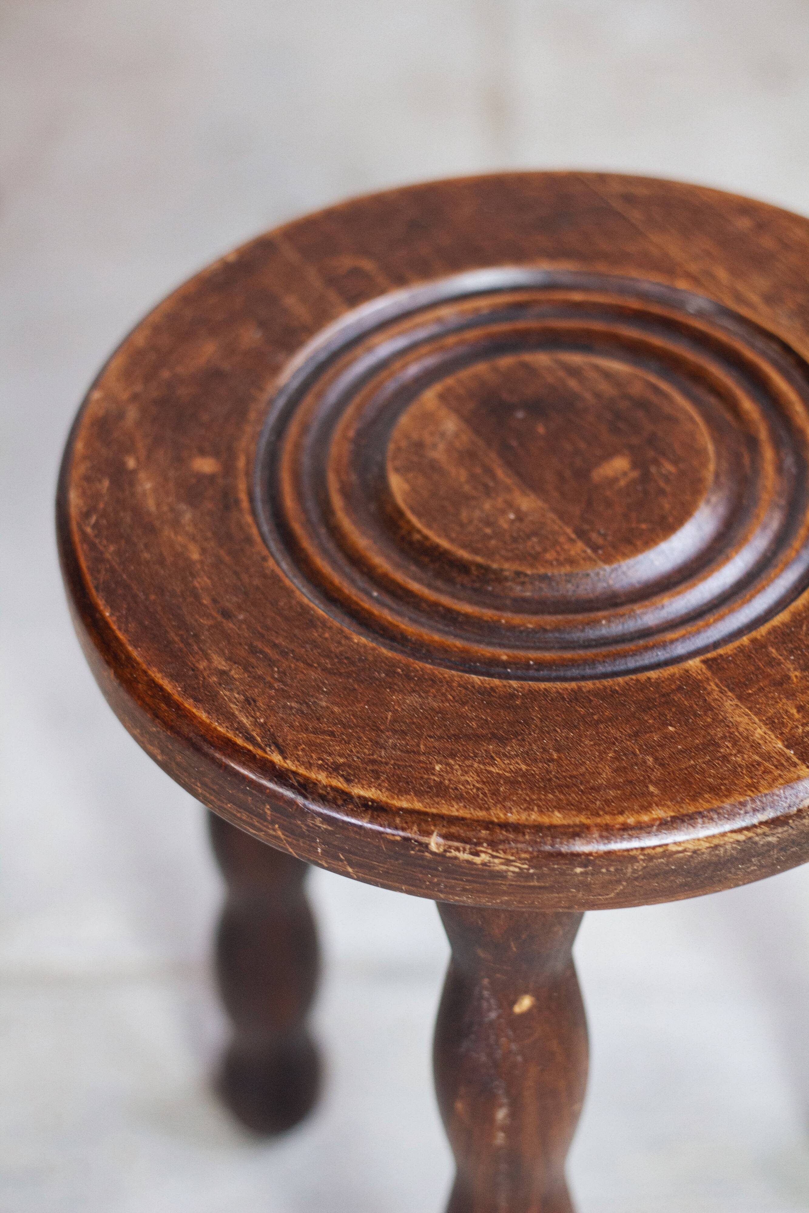 Tripod stool in turned wood in the style of Charles Dudouyt, 1950