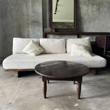 Coffee table, round antique Indonesian teak table with straight legs.