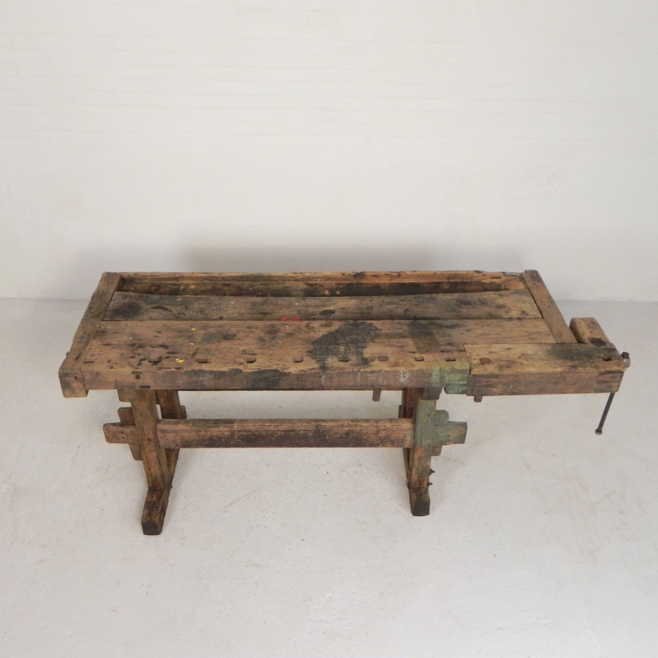 Wooden industrial workbench with vice, 194 cm long, 1930s.