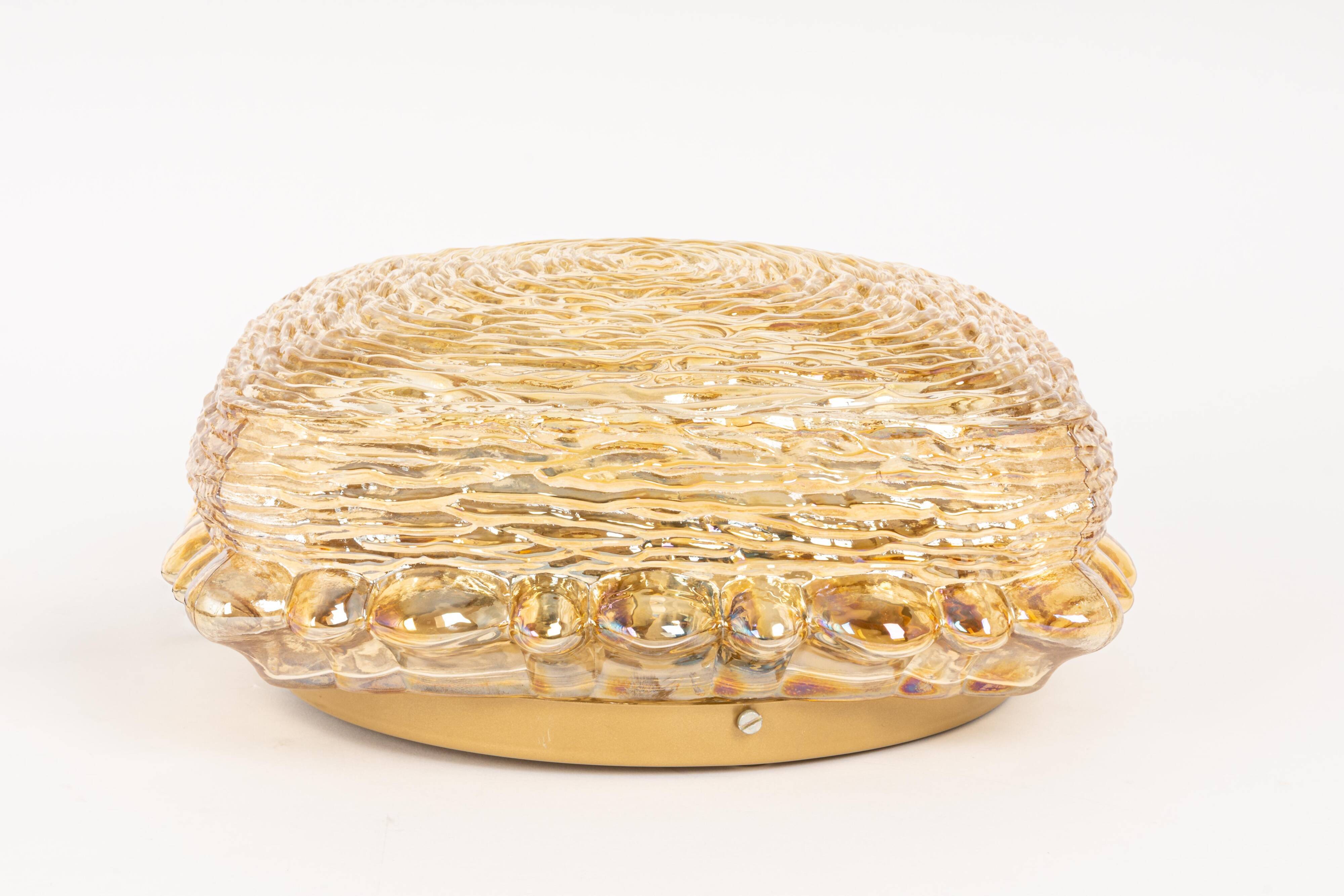 Amber glass wall light in the shape of a fingerprint, Germany, 1970s.