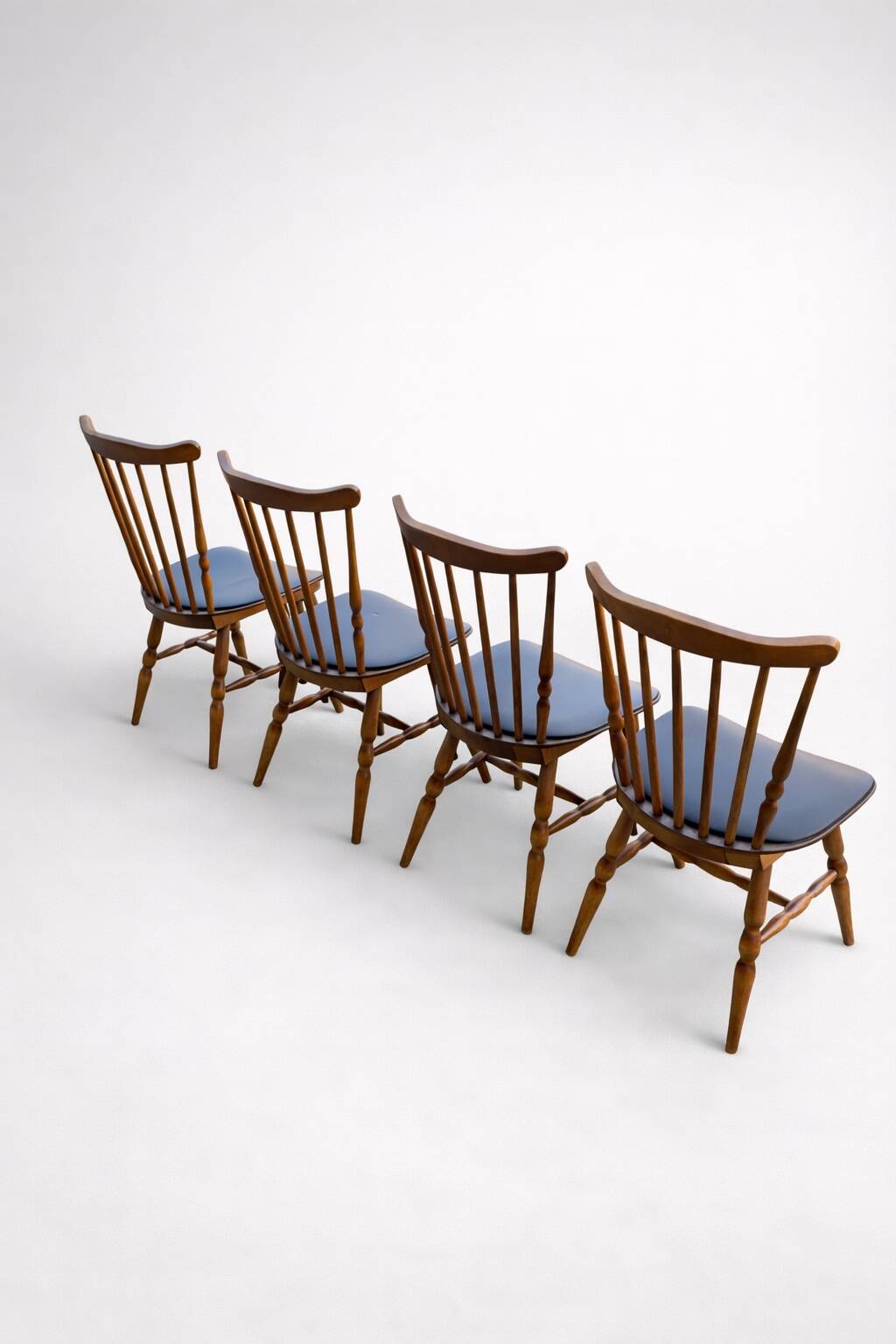Set of 4 Baumann "Menuet" chairs – stained beech and black faux leather – French design
