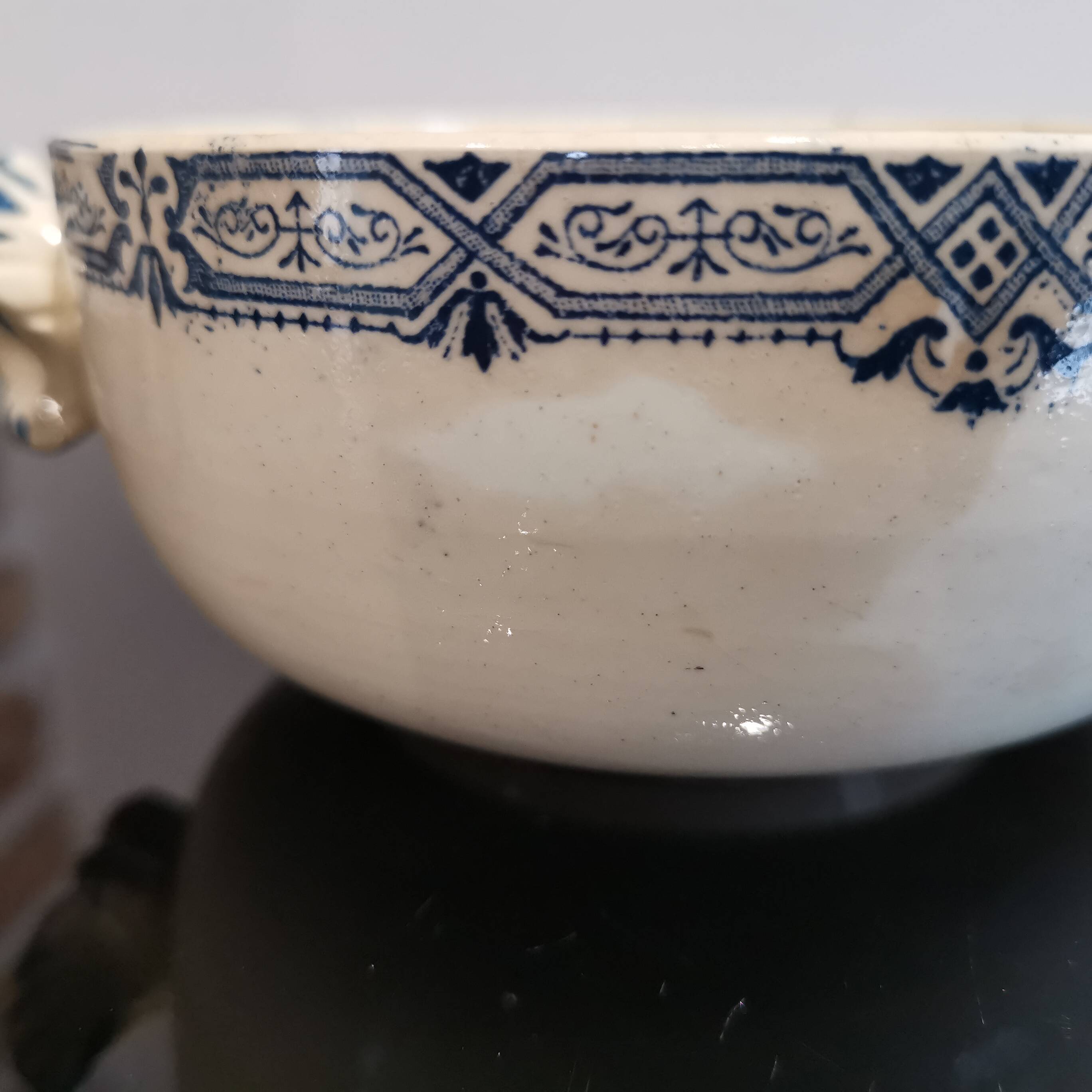 Butterfly ear bowl in iron clay with blue patterns