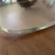 Vintage lucite and brass shelf with its hooks.