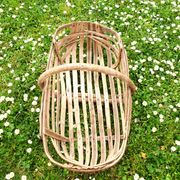 Old wooden harvest basket, slatted wooden basket, folk art.
