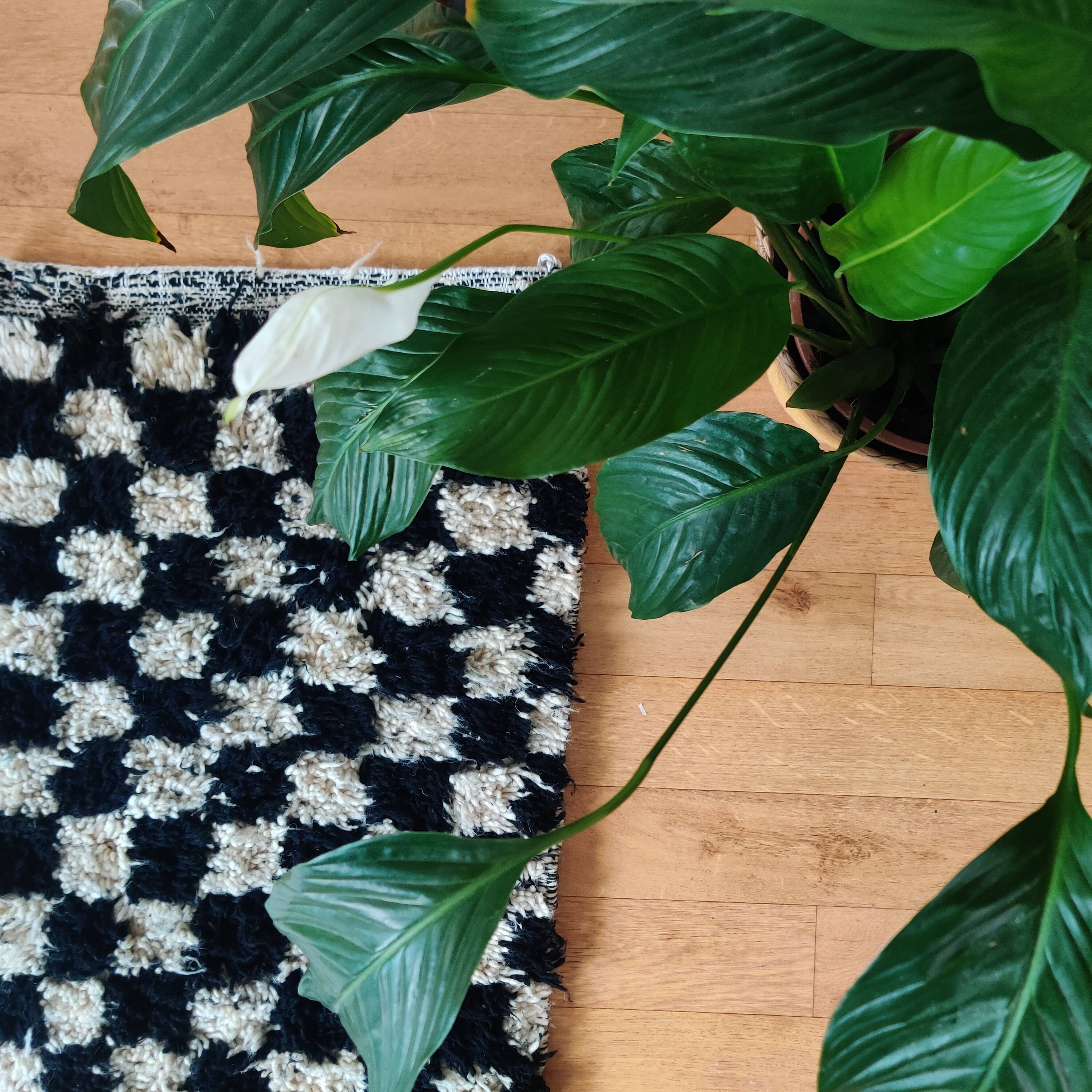 Small black tile Berber rug