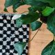 Small Berber rug with black tiles.
