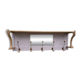 Coat rack or wall-mounted entrance wardrobe with scroll arms and antique hooks.