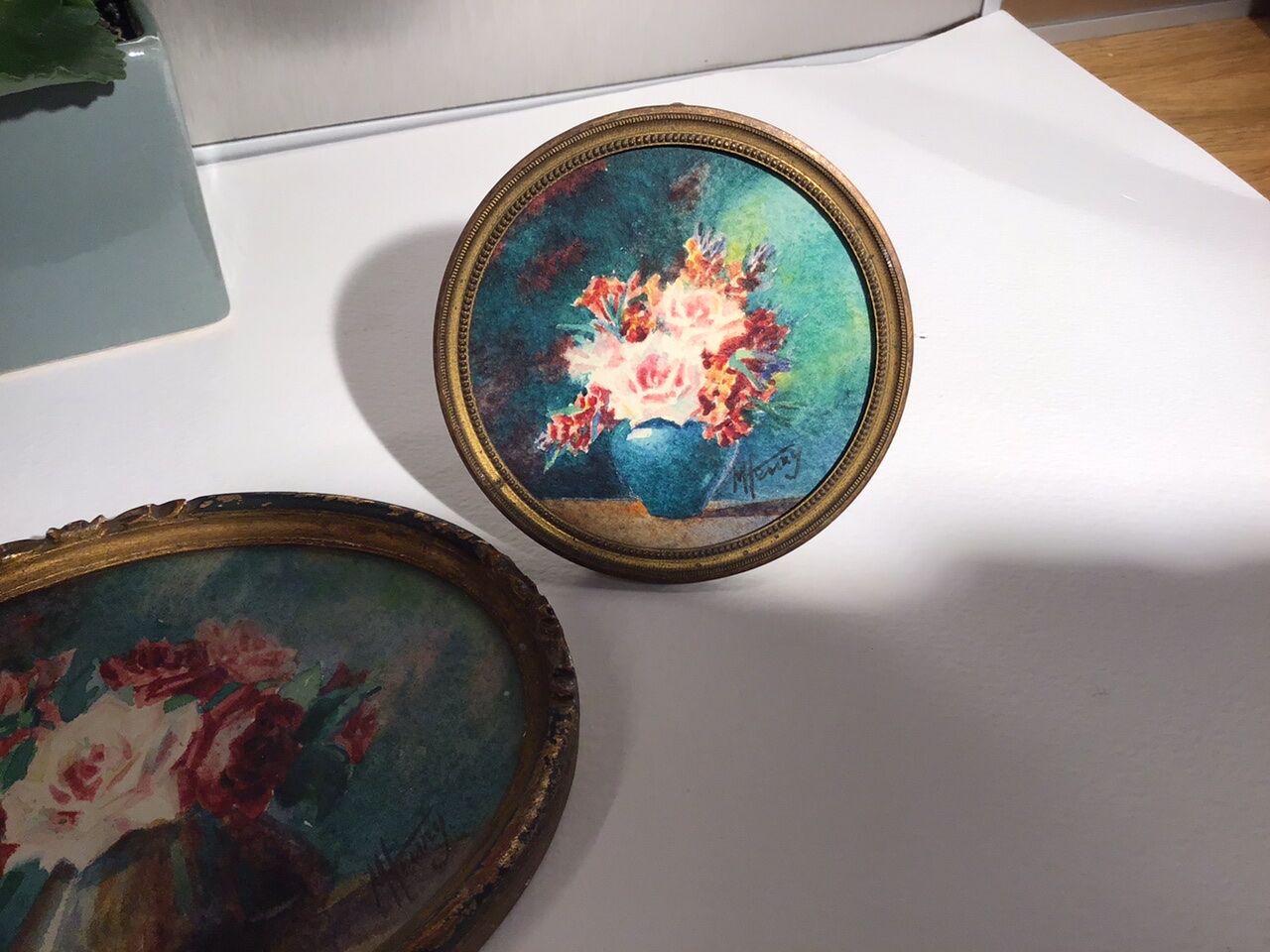 Three old paintings, still lifes with bouquets of roses, signed M Henry