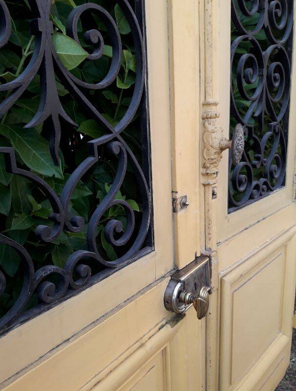 19th century double arched entrance door in oak with grilles and old glass