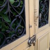 Porte d'entrée cintrée double en chêne, grilles et verre, XIXème