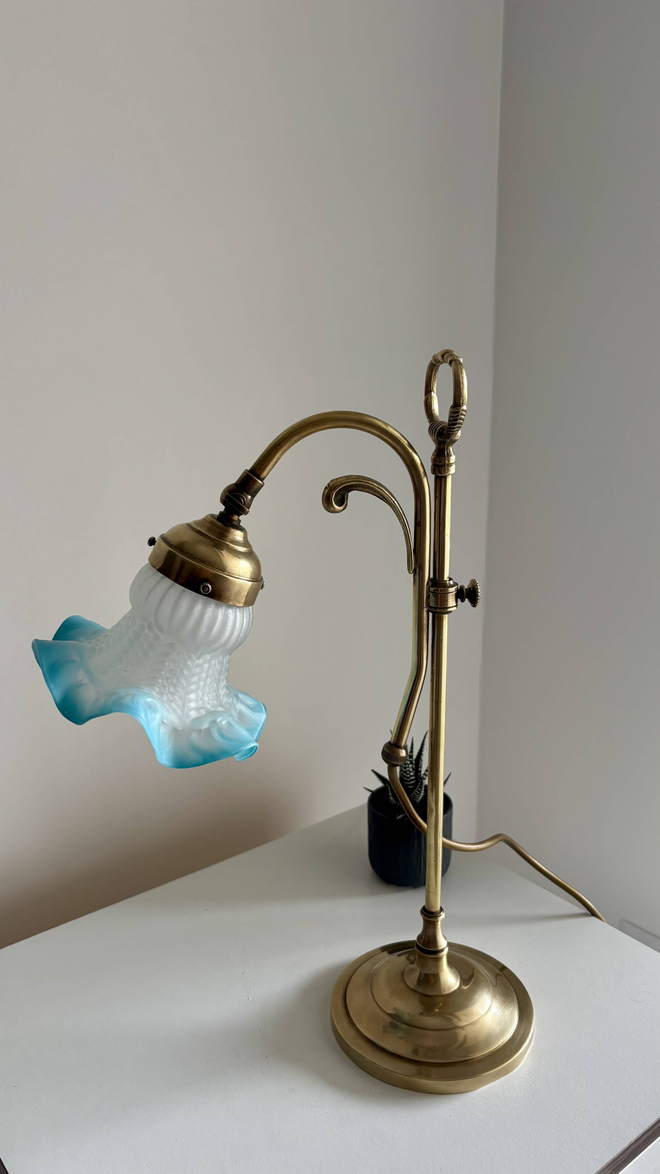 Art Nouveau style gilded brass lamp with sky blue opaline tulip