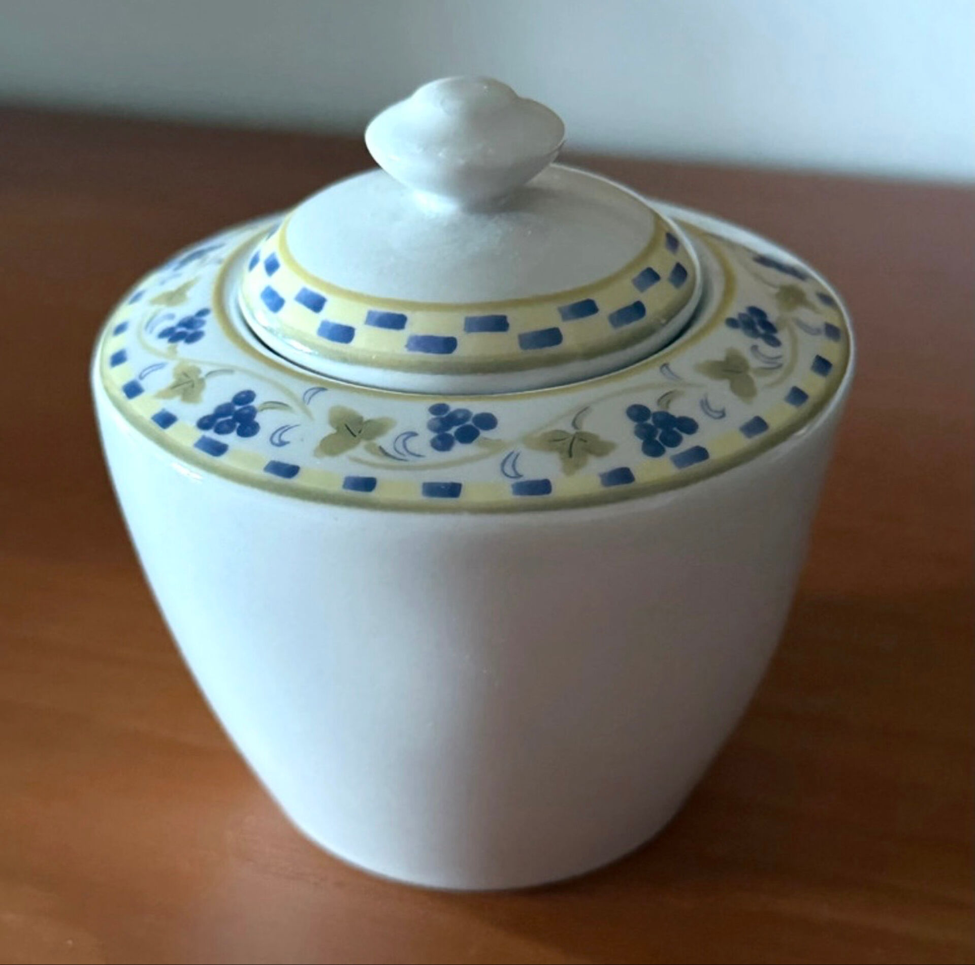 Fine porcelain sugar bowl from Bavaria with a grape design.