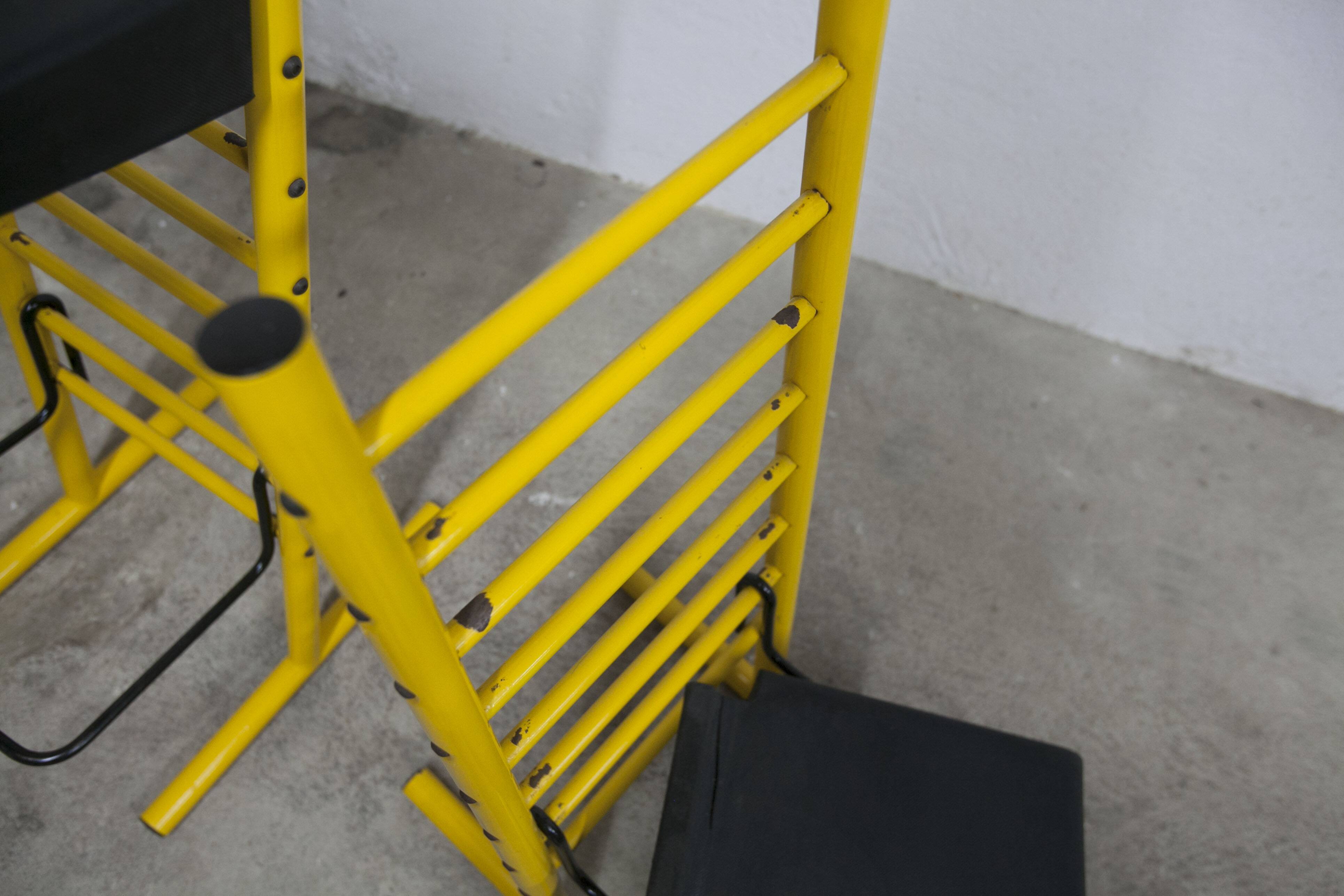 Pair of adjustable Italian bar stools in lacquered yellow and black