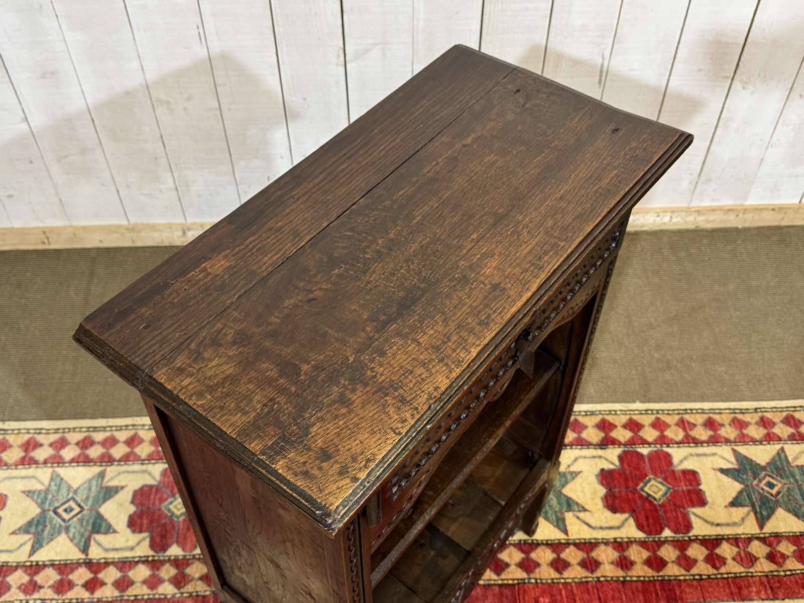 Oak accent furniture bookshelf with a drawer, early 20th century work.