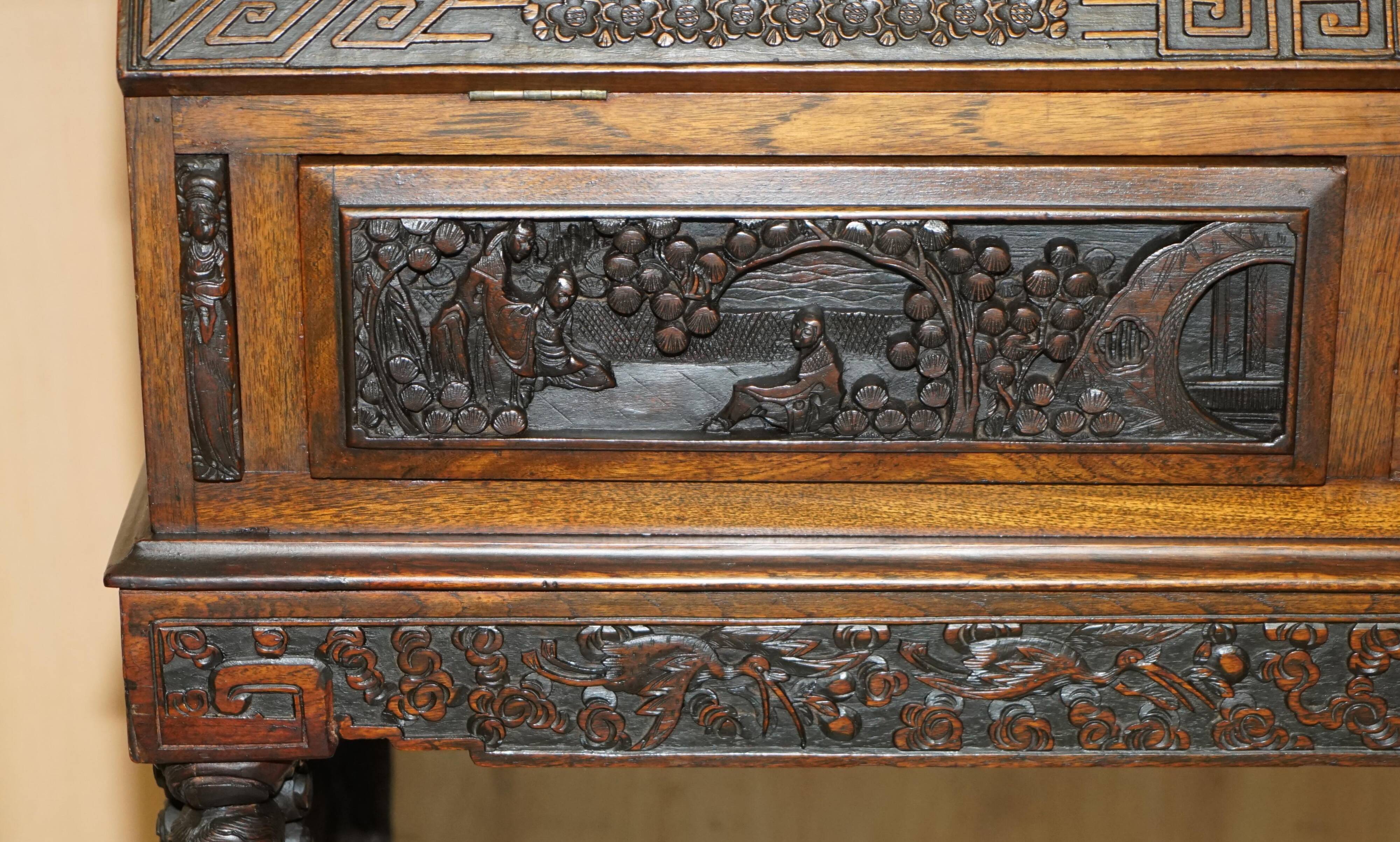 Chinese hand-carved desk from around 1940 with matching chair.