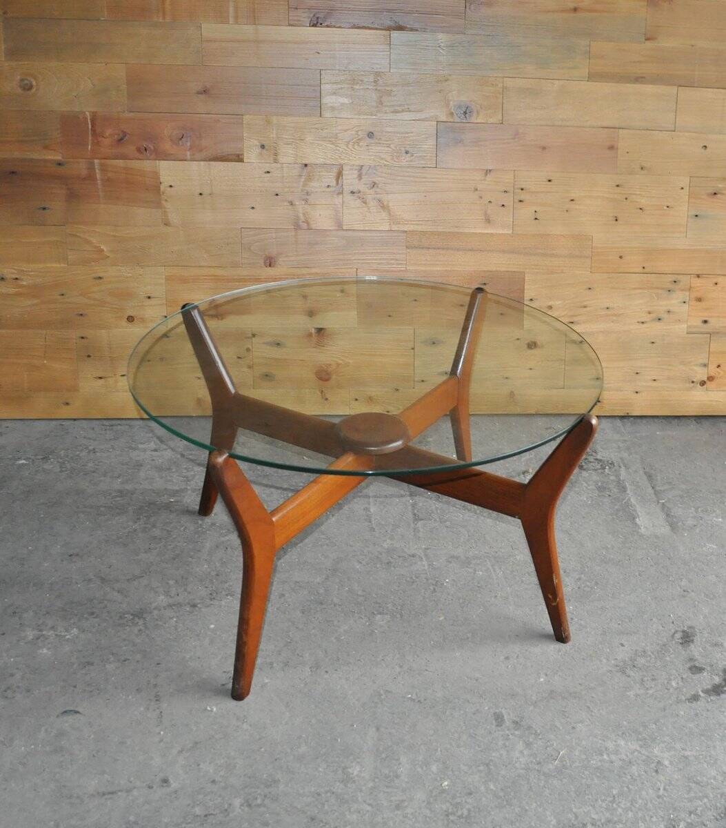 Mid-century coffee table in brown teak with a floating tempered glass top.