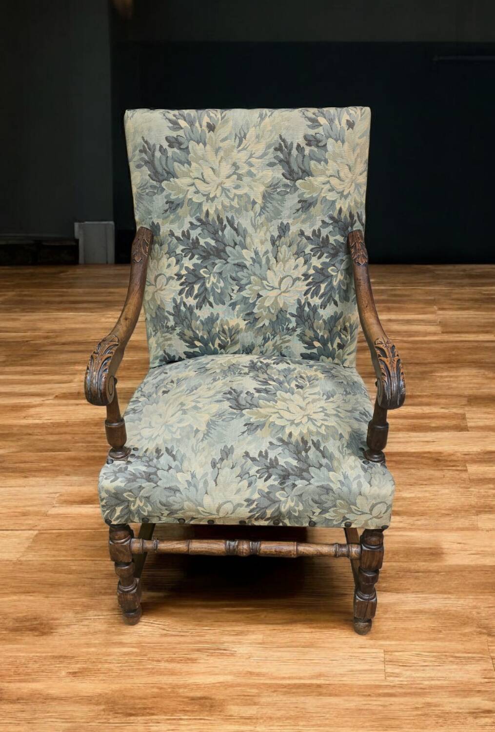 Empire armchair in carved wood and floral fabric
