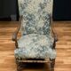 Empire armchair in carved wood and floral fabric