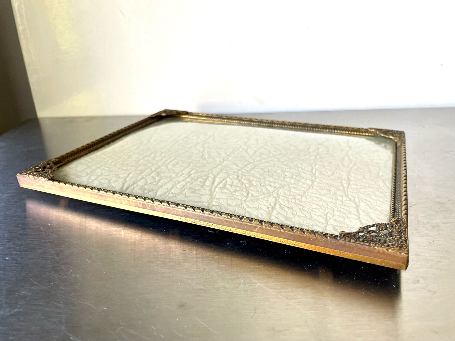 Metal frame in gold colored brass