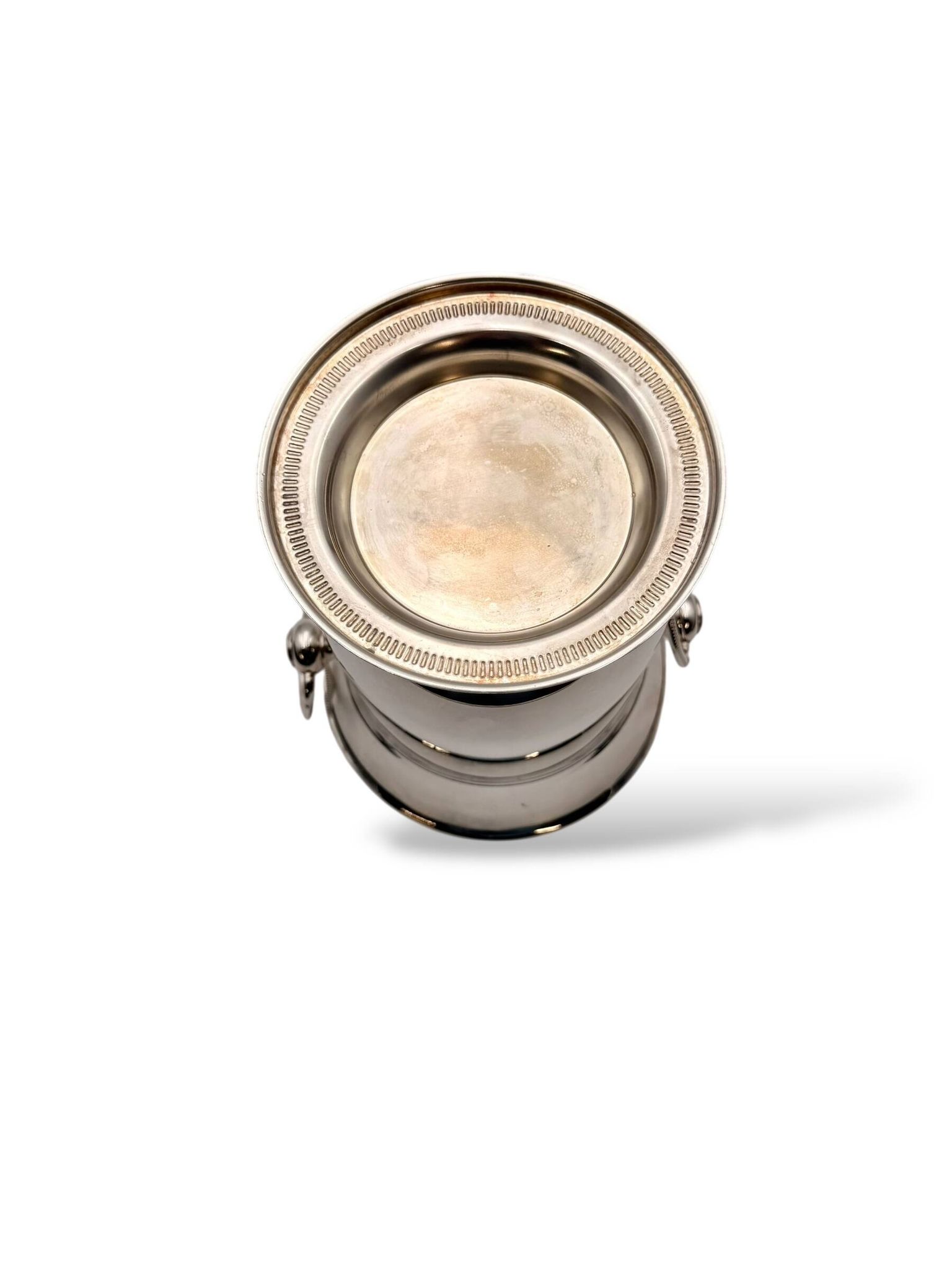 Silver-plated champagne bucket with ring handles.