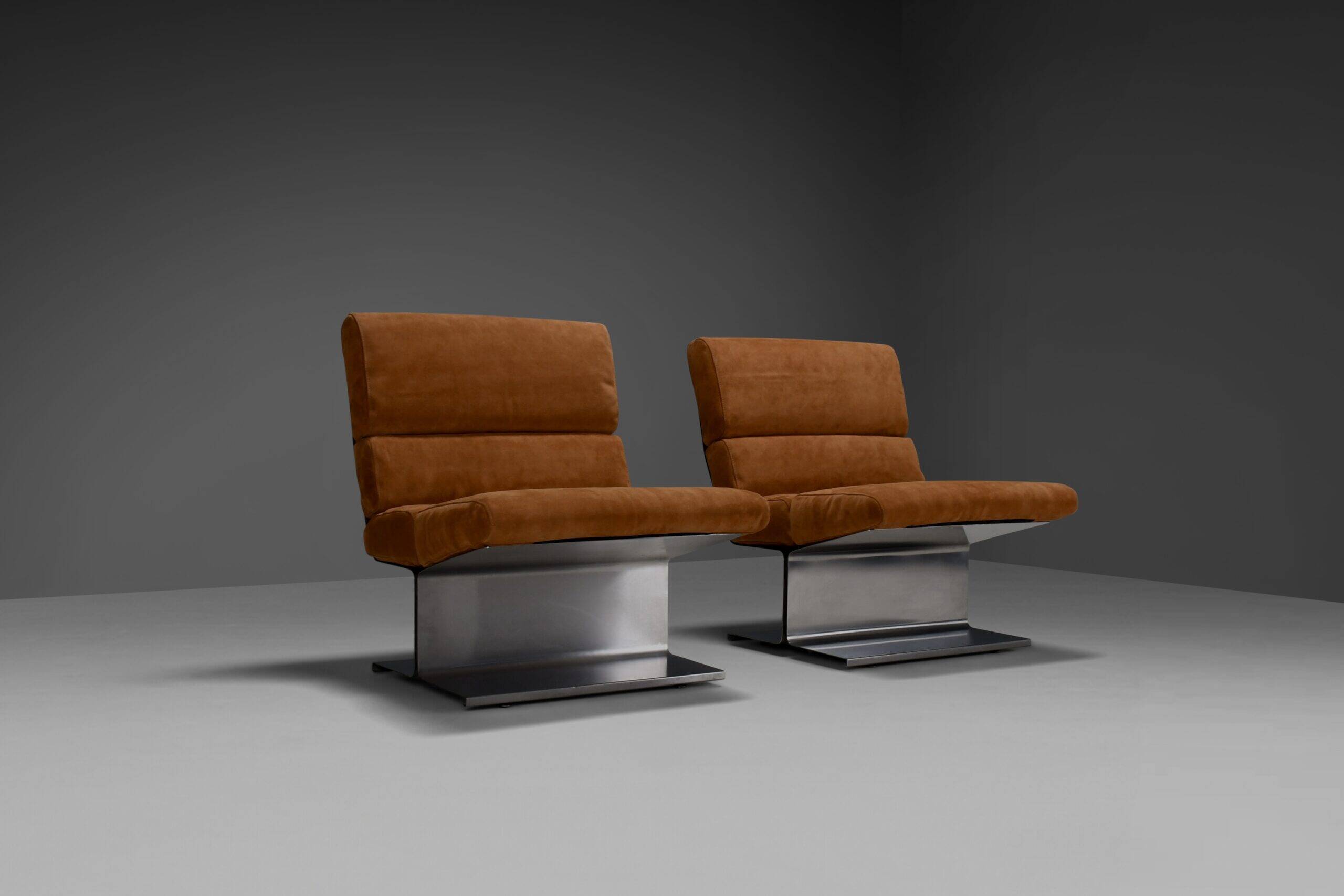 Very rare pair of leather and steel lounge chairs by Paul Geoffroy for Uginox