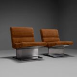 Very rare pair of leather and steel lounge chairs by Paul Geoffroy for Uginox