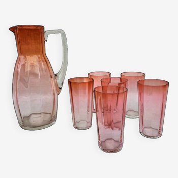 Drinking service in orange-pink glass