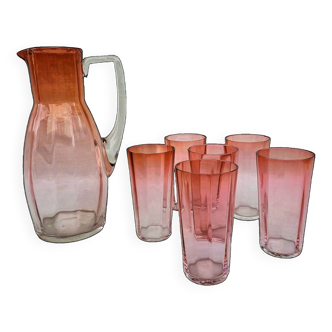 Drinking service in orange-pink glass