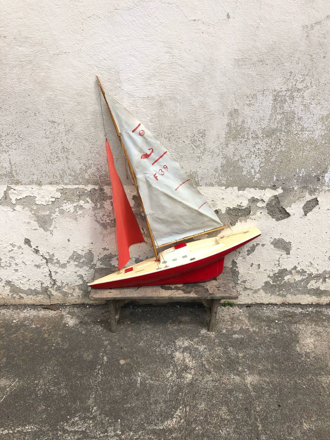 Old plastic pond sailboat, old plastic boat