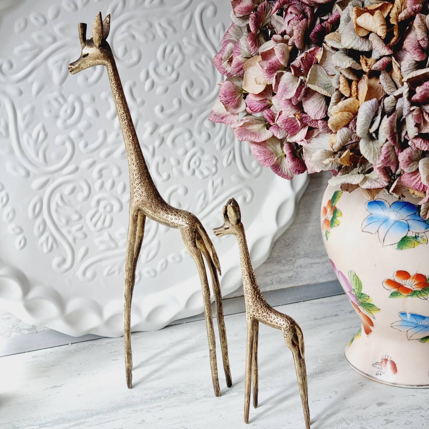 Stylized brass giraffes