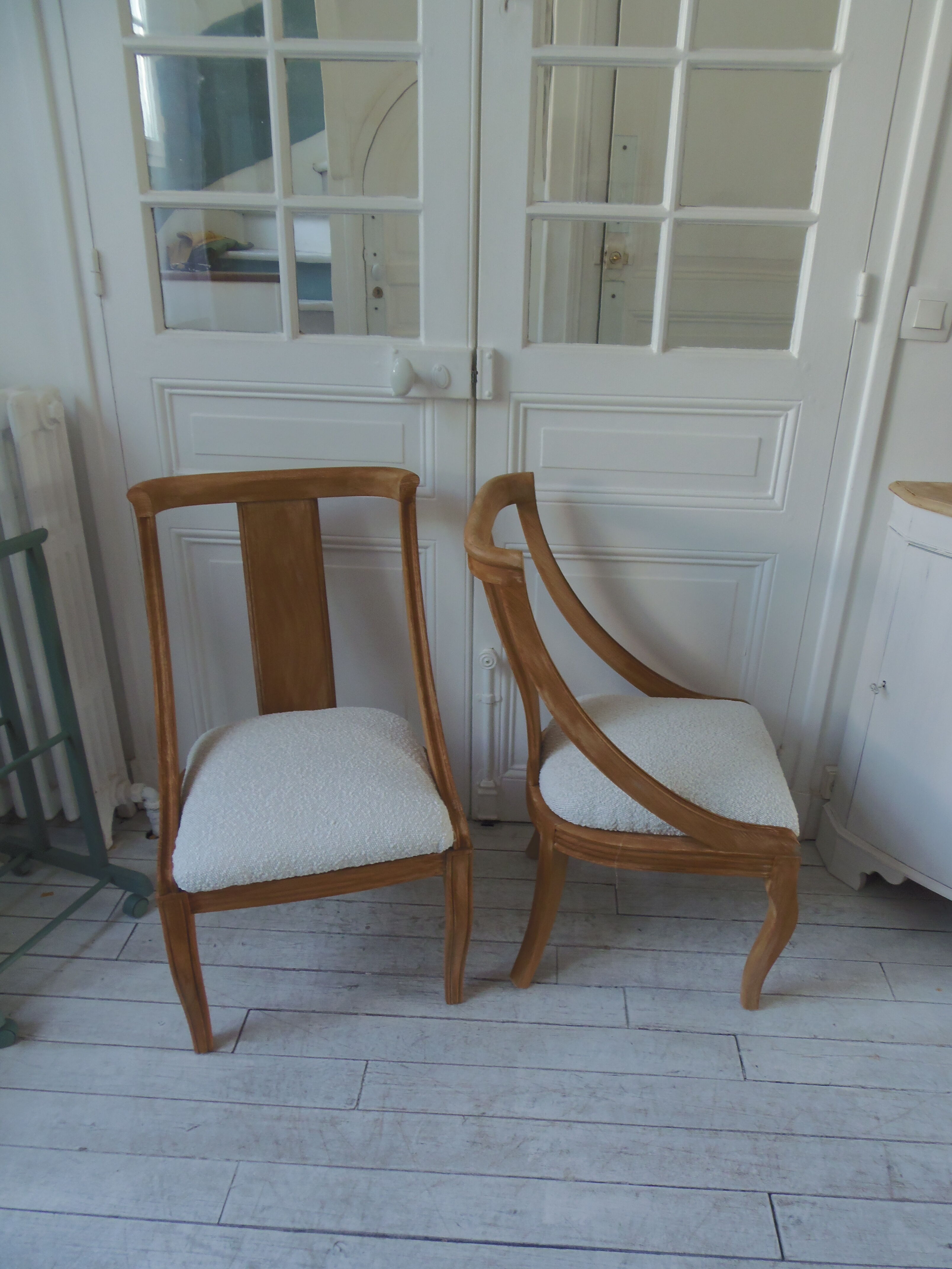Pair of Gondola heaters, upholstered with a cream curl fabric