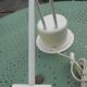 Massive swing desk lamp has two lights and a kneecap