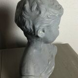 Child bust in grey patinated plaster