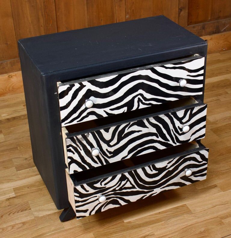 Restored chest of drawers with zebra tapestry 20th century