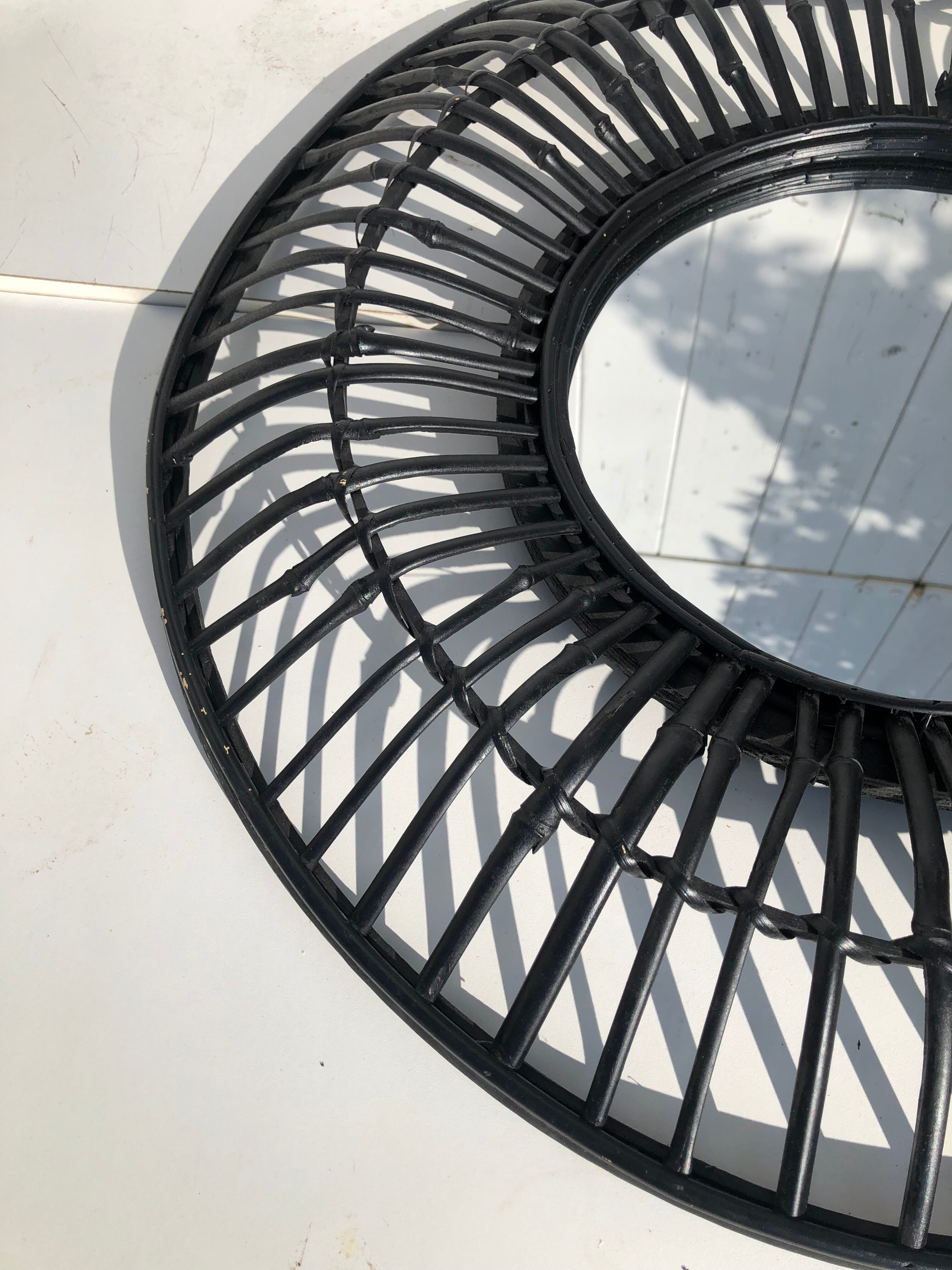 Round black rattan mirror